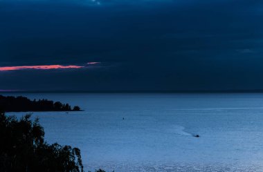 Summer sunset over the Ob sea. District of Berdsk, the confluence of the two rivers Berdi and Ob, Novosibirsk region, Western Siberia, Russia clipart