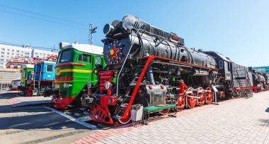 Novosibirsk, Western Siberia, Russia-April 15, 2018: the territory of the Novosibirsk Museum of railway equipment. N. A. Akulinin with retro exhibits clipart
