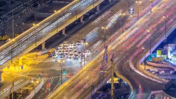 Night traffic on a busy intersection at Dubai downtown highway aerial timelapse — Stock Video