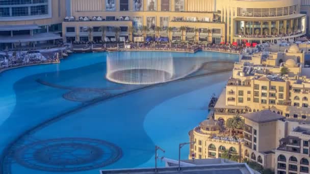 Evening aerial view Dancing fountains downtown and in a man-made lake timelapse in Dubai, UAE. — Stock Video