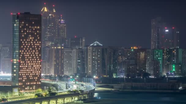 Buildings on Al Reem island in Abu Dhabi night timelapse from above. — Stock Video