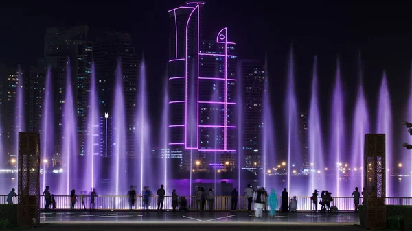 Evening Musical fountain show. Singing fountains in Sharjah timelapse, UAE 4K