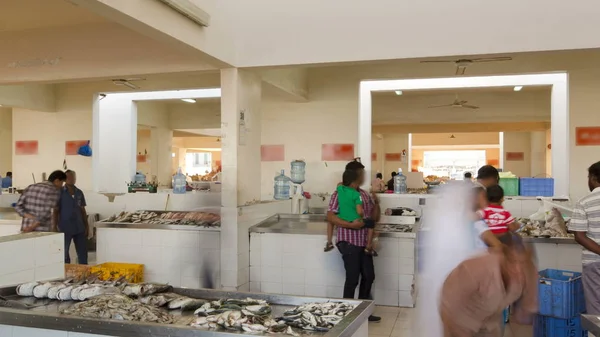 AJMAN, UAE - SEPTEMBER 2016: Fish market in the emirate of Ajman timelapse with people selling fish. United Arab Emirates 4K