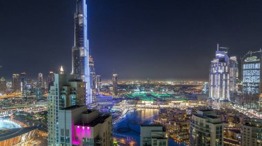 Dubai downtown cityscape with Burj Khalifa, LightUp light show aerial timelapse from rooftop and fountains. With the largest light and sound show on a single building The United Arab Emirates city of Dubai has broken the Guinness World Record clipart
