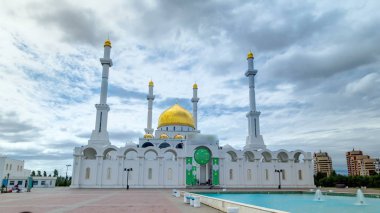 Exterior of the Nur Astana mosque timelapse hyperlapse with blue cloudy sky in Astana, Kazakhstan. This mosque is the second largest in Kazakhstan. 4K clipart