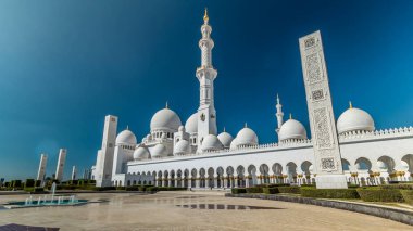 Fountain at Sheikh Zayed Grand Mosque timelapse hyperlapse  located in Abu Dhabi - capital city of United Arab Emirates. Mosque was initiated by late President of UAE Sheikh Zayed bin Sultan Al Nahyan. It is largest mosque in UAE. Blue cloudy sky clipart