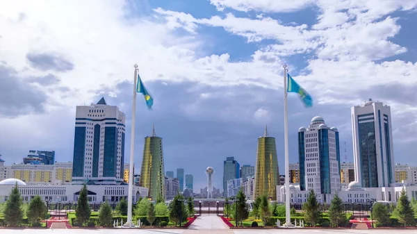 View of Astana modern city with baiterek and towers timelapse with flags and clouds from president palace. Astana is the capital city of Kazakhstan on 10 December 1997.