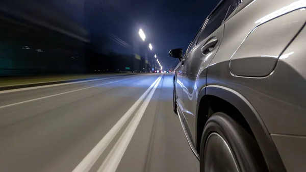 timelapse Driving at high speed through the streets timelapse drivelapse hyperlapse. View from side of car with slider movement at night city road