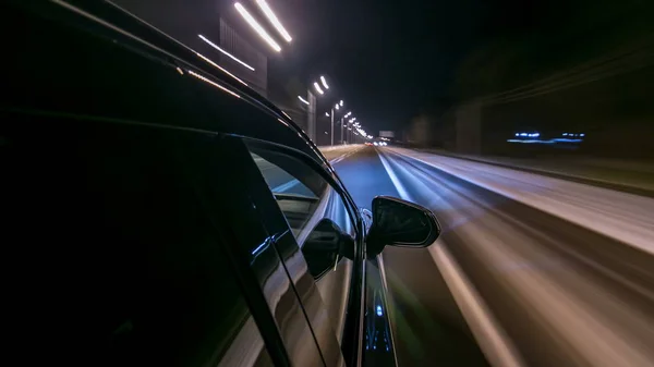 timelapse Driving at high speed through the streets timelapse drivelapse hyperlapse. View from side of car with slider movement at night city road