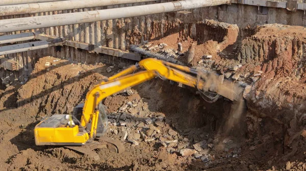 Yellow jackhammer machine on a construction site working on moscow metro timelapse