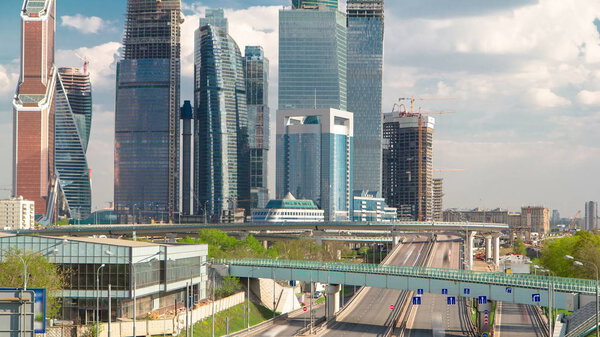 Skyscrapers International Business Center City at cloudy day with traffic and overpass timelapse, Moscow, Russia 4K