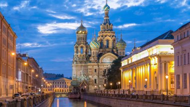 Church of the Savior on Spilled Blood night timelapse with reflection in Griboyedov canal. This is an architectural landmark of central St Petersburg, and a unique monument to Alexander II the Liberator. clipart