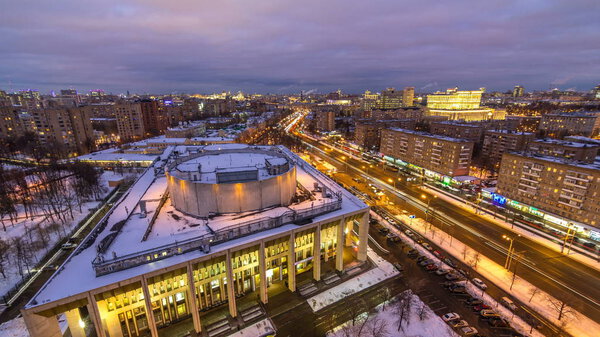 Moscow city Russia skyline aerial panoramic top view day to night transition timelapse. Moscow Youth Palace, Komsomol avenue, residential building. Urban winter snow scenery architecture background