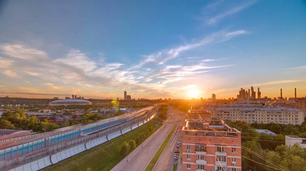 The Third Ring Road traffic at sunset timelapse aerial view from rooftop. Skyscrapers and stadium on background. The Third Ring is Moscow's newest beltway, located between the Garden Ring in the city centre and Moscow Ring Road. Moscow, Russia. City,
