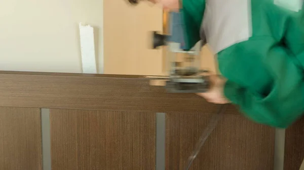 Close Carpenter Hands Green Uniform Doorlock Lock Process Installation Wood — Stock Photo, Image