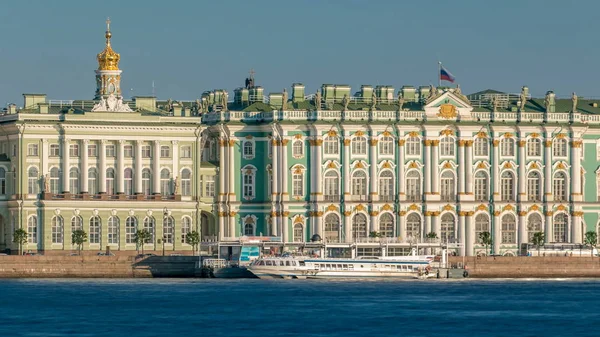 Tourists in the excursion boat sail on The Neva River timelapse. On the back side is The State Hermitage Building (Winter Palace). St. Petersburg, Russia