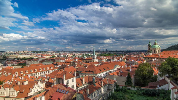 Panorama of Prague Old Town with red roofs timelapse, famous Charles bridge and Vltava river, Czech Republic. View from above near Prague castle