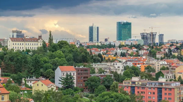 View of Prague timelapse from the observation deck of Visegrad. Prague. Czech Republic. Red roofs and modern buildings on background. Stormy weather with dark clouds