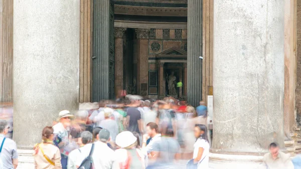 Entrance to Pantheon. Tourists visit the Pantheon timelapse in Rome, Italy. Pantheon is a famous monument of ancient Roman culture, the temple of all the gods, built in the 2nd century.