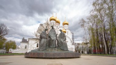 YAROSLAVL, RUSSIA - CIRCA MAY 2014: Trinity sculpture near Assumption Cathedral. Assumption Church timelapse hyperlapse or Dormition cathedral in summer, Yaroslavl city. city from the list Golden ring on the Volga river, Russia. clipart