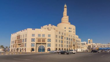 Qatar Islamic Cultural Centre timelapse hyperlapse in Doha, Qatar, Middle-East. Traffic on the road. Blue sky at sunny day clipart