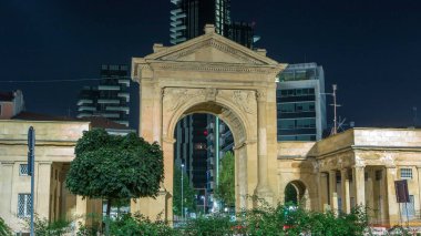The Porta Nuova city gates with night illumination timelapse in Milan Italy. Traffic on the road. Skyscrapers on background clipart