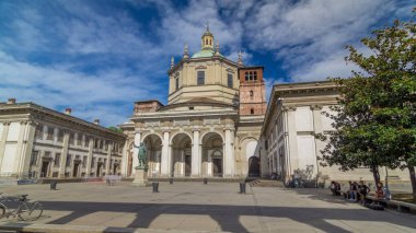 Facade of San Lorenzo Maggiore Basilica timelapse hyperlapse(Saint Lawrence the Major Cathedral) and statue of Constantine emperror in front. Blue cloudy sky at summer day. Nice travel destination clipart