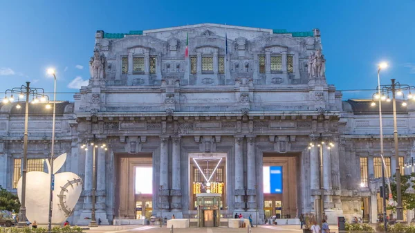 Milano Centrale day to night transition timelapse in Piazza Duca d'Aosta is the main railway station of the city of Milan in Italy. Traffic on the road.