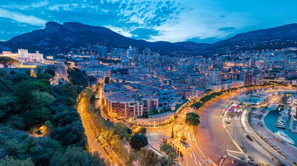 Мбаппе Днем Ночью Переходит Монако Геркулес Здания Подсветкой Холмами Заднем — стоковое фото