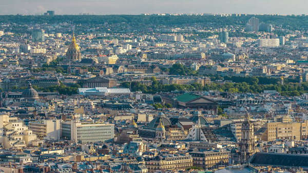 Panorama of Paris timelapse with Les Invalides, France. Top view from Sacred Heart Basilica of Montmartre (Sacre-Coeur). Sunny day with blue cloudy sky.