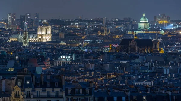 Beautiful Paris night cityscape timelapse seen from Montmartre with Notre Dame de Paris and Pantheon. Top view from viewpoint. Paris, France