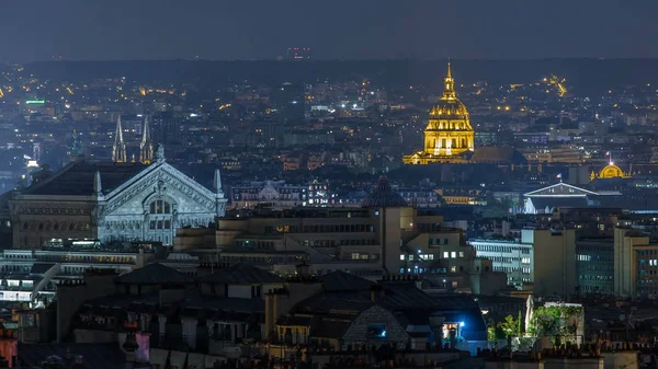 Beautiful Paris night cityscape timelapse seen from Montmartre with Garnier opera and Les Invalides. Top view from viewpoint. Paris, France