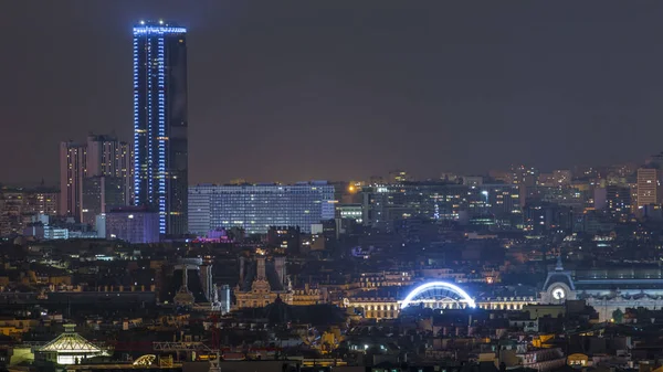 Beautiful Paris night cityscape timelapse seen from Montmartre with the tour Montparnasse skyscraper. Top view from viewpoint. Paris, France