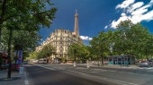 Eiffel Tower behind historic buildings in Paris timelapse hyperlapse, France. Blue cloudy sky at summer day with green trees and traffic on the street