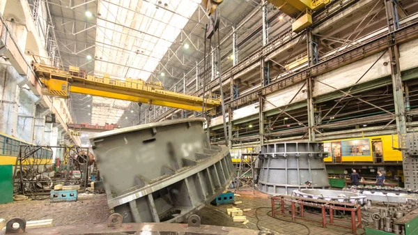 Industrial production of turbines for heavy industry timelapse. Huge steel turbine components movement. Industrial. Manufacture of water turbines. The huge machine turbine production. Large parts of the plant.