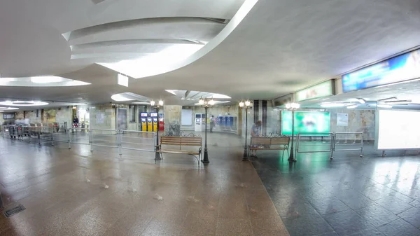 Entrance to Historic Museum metro station on Saltivska Line of Kharkiv metro timelapse hyperlapse, with a passengers near ticket machines, in Kharkov, Ukraine