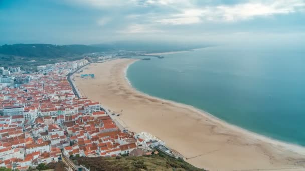 View of Nazare panorama with cabins of Funicular timelapse. Fog coming from ocean at evening during sunset. — Stock Video