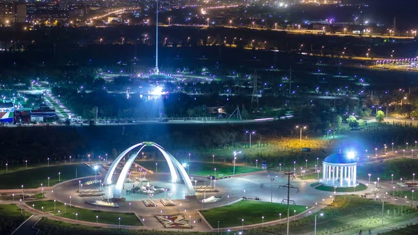 Park named after the First President of the Republic of Kazakhstan in the city of Aktobe night timelapse. Aerial top view from above. Western Kazakhstan.