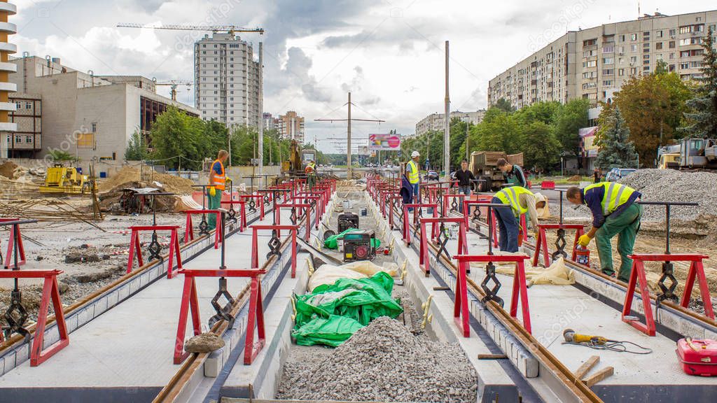 Tram rails at the stage of their installation and integration into concrete plates on the road timelapse. The process of reconstruction of tram tracks