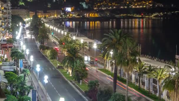 Natt antenn panorama över Nice timelapse, Frankrike. Belyst gamla stan lilla gator och waterfront — Stockvideo
