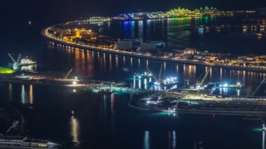 Palm Jumeirah Adası gece timelapse havadan görünümü.