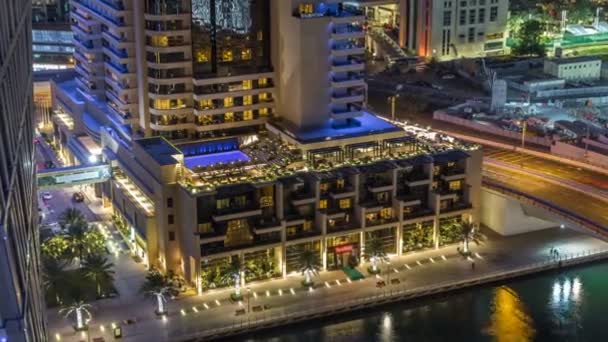 Luxury Dubai Marina canal with passing boats and promenade night timelapse, Dubai, United Arab Emirates — Stock Video