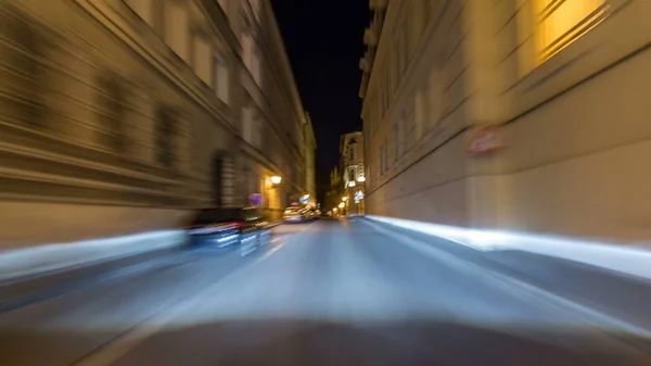 Drive at fast speed at the night streets in downtown timelapse hyperlapse drivelapse. Blured road with lights on high speed. Prague, Czech