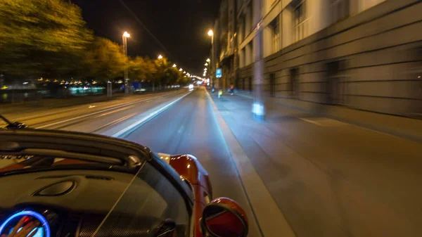 Car moves at fast speed at the night streets timelapse hyperlapse drivelapse. Blured road with lights reflected from car on high speed. Prague, Czech