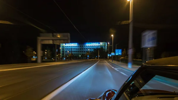 Car moves at fast speed at the night streets timelapse hyperlapse drivelapse. Blured road with lights reflected from car on high speed. Prague, Czech