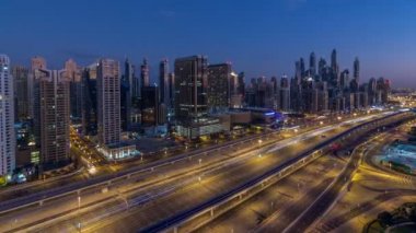 Dubai Yat Limanı gökdelenler için gün timelapse, Birleşik Arap Emirlikleri Dubai gece Jlt üzerinden doğmadan'deki hava üstten görünüm.