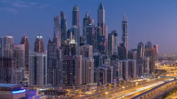 Dubai Marina skyscrapers aerial top view before sunrise from JLT in Dubai night to day timelapse, UAE. — Stock Video