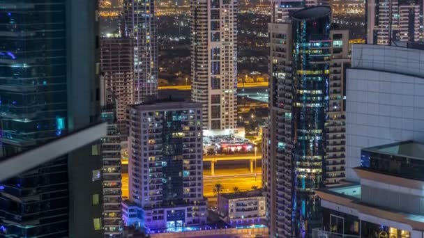 Dubai marina and JLT skyscrapers aerial skyline night timelapse. — Stock Video