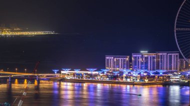 Bluewaters Island hava gece timelapse yeni alışveriş merkezi ve restoranlar, alanda yürüyüş, eğlence ve seyahat Dubai'de spot açılan