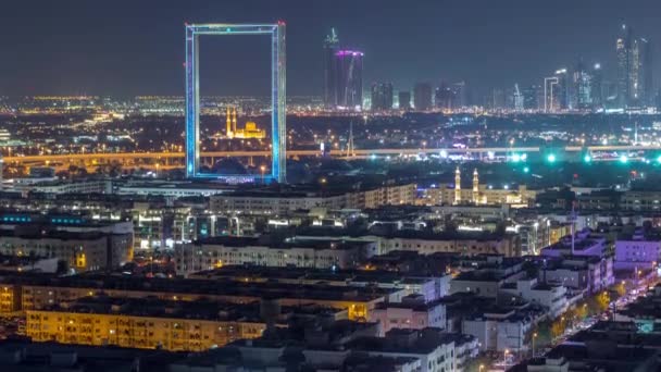 Dubai Frame with Zabeel Masjid mosque illuminated at night timelapse. — Stock Video